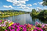 The picturesque town of Sandpoint, Idaho with kayakers on Lake Pend Oreille