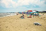 A busy day at the beach in Dauphin Island, Alabama. Editorial credit: HarrisonJeffs / Shutterstock.com.
