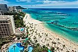 Aereal photo of Waikiki beach with view of Diamond Head mountain in the distance.