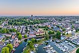 Drone view of Ely Cathedral with Ely Marina and Great Ouse River in foreground, Ely, Cambridgeshire, England.