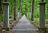 Row of concrete pillars and metal arches on Rose Island, Indiana