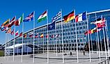 The national flags of countries member of the NATO fly outside the organisation headquarters in Brussels, Belgium.
