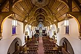 Interior nave of the historic St. Matthew's Episcopal Cathedral in Laramie, Wyoming. Image by Nagel Photography via Shutterstock.
