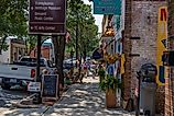 Downtown Manteo, North Carolina, showing the brick sidewalks and Poor Richard's Sandwich Shop. Image by Wileydoc via Shutterstock.