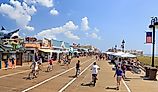 People walking and biking along the boardwalk in Ocean City, New Jersey. Editorial credit: Vlad G / Shutterstock.com 