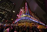 The iconic marquee of Radio City Music Hall. Via Shutterstock / Gordon Donovan