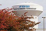 The water tower of NWWA Montgomery Township with the fall foliage, Pennsylvania. Image credit Khairil Azhar Junos via Shutterstock