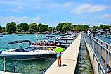 Pier and luxury boats docked in the Skaneateles Lake, one of the Finger Lakes