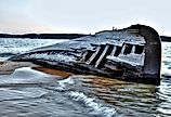 Beached shipwreck on Lake Superior coast. 
