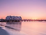 Busselton Jetty stretching into the ocean at sunset in Western Australia