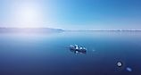 Aerial view of a ship floating in the water. Lake Baikal. Blue water.