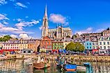 Fishing boats inside the port of Cobh, a city with colorful houses in Ireland