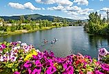 A group of kayakers enjoy a beautiful summer day on Sand Creek River and Lake Pend Oreille in the downtown area of Sandpoint, Idaho. 