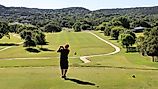 A golfer takes a practice swing at the Scott Schreiner Municipal Golf Course in Kerrville, Texas, United States.