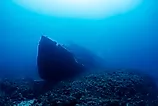 Wreck of an old ruined ship on ocean rocky bottom