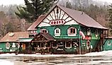 Hoss's Country Corner, charming and rustic souvenir and gift shop in Long Lake, New York in wintertime. Editorial credit: debra millet / Shutterstock.com