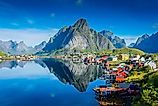 Perfect reflection of the Reine village on the water of the fjord in the Lofoten Islands, Norway