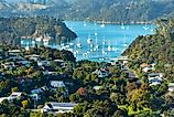 View of the harbor in Russell, New Zealand. Image Credits: Advocate via Shutterstock