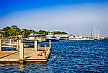 People on a landing dock for Cumberland Island at St. Mary's in Georgia, USA, via csfotoimages / iStock.com
