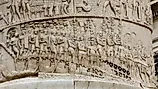 Detailed stone relief on Trajan's Column shows Roman soldiers during a military campaign. Image credit: History Skills / Shutterstock.com.