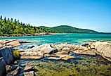 Trees, rocks, forest and Lake on the Under the Volcano Trail along the beautiful rocky coast of Lake Superior at Neys Provincial Park, Ontario, Canada