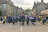 Pipe Band marching down Pitlochry High Street for the Highland Night. Image credit: Alan M. Walker / Shutterstock.com