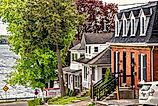 Editorial Photo Credit: JohnInNorthYork via Shutterstock. Brockville, Ontario - May 13, 2024: Street Leading Down to the River