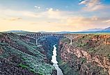 Taos, New Mexico, USA at Rio Grande Gorge Bridge over the Rio Grande at dusk. Image credit Sean Pavone via Shutterstock.