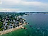 Pequot Point Beach and New London Harbor Lighthouse at the mouth of Thames River in city of New London, Connecticut. 