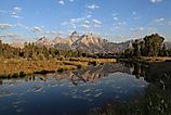 A scenic view of Schwabacher Landing at Grand Teton National Park, Wyoming in sunrise. 