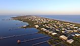 Stilt houses with long docks in the low-lying town of Grand Isle, Louisiana.