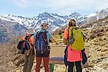 Three hikers gaze at Sierra Nevada's highest peaks, Mulhacen and Alcazaba. Credit: Alejandro M. Ferrer / Shutterstock