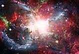 Open space filled with stars, nebulae and galaxies.
