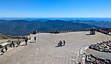  Tourists standing on the observation deck at the summit of Mount Washington. Editorial credit: travelview / Shutterstock.com