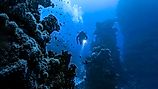 Underwater diver in deep sea dive. 