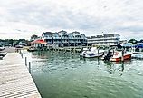 Wooden pier and waterfront in Chincoteague, Virginia. Image credit Kosoff via Shutterstock