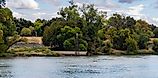 Levee on sacramento river panorama with drainage pipe 