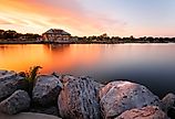  Beautiful sunset of Seneca Lake and Finger Lakes Welcome Center in Geneva, NY. Image credit Jay Yuan via Shutterstock.