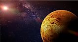 Venus, the slowest-spinning planet in the Solar System, illuminated against the Sun and stars.