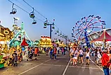 People stroll through the midway at the Arizona State Fair. By Gregory E. Clifford / Shutterstock.com