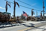 An American flag in Fort Myers Beach, Florida, after Hurricane Ian. Image credit Jeff McCollough via Shutterstock