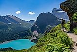 A hiker admiring the scenic landscape in Glacier National Park, Montana.