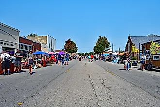People browse the booths set up along Commercial street in downtown Emporia, Kansas - mark reinstein