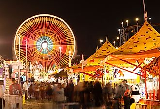 State Fair with carnival, midway, games, rides, and a Ferris wheel.
