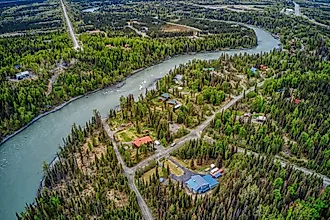 The turquoise waters of the Kenai River flowing along the Chugach Mountains.