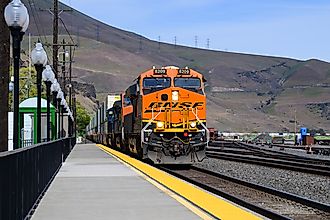 Freight train passing Wishram, Washington. Editorial photo credit: Ian Dewar Photography/Shutterstock