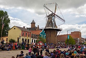 Downtown Pella, Iowa, during the Tulip Time Festival Parade. Image credit yosmoes815 via Shutterstock
