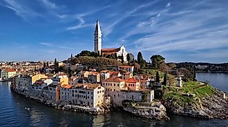 Scenic view of Rovinj old town with colorful houses and Church of St. Euphemia overlooking Adriatic Sea in Croatia.