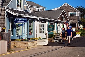 A couple browsing the small boutique stores of Perkins Cove in Ogunquit, Maine, USA. Editorial credit: James Kirkikis via Shutterstock.com