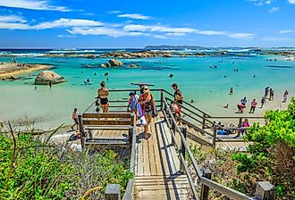 Wooden staircase to Greens Pool with people swimming and canoeing on the sheltered waters of William Bay, Denmark, Western Australia. Image credit Benny Marty via Shutterstock.